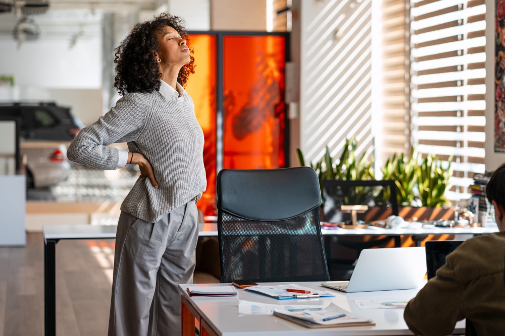 Woman stretching at work