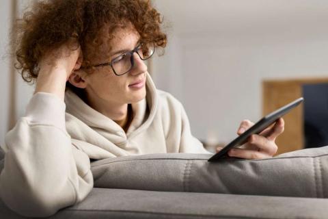 person looking at screen glasses