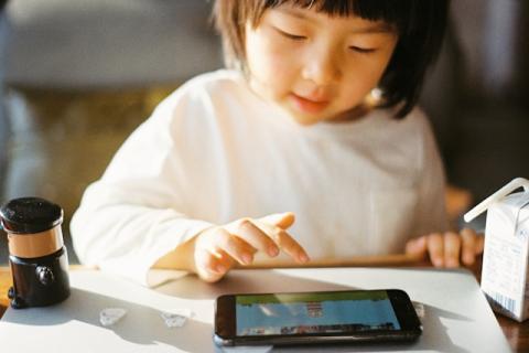 toddler using a mobile phone
