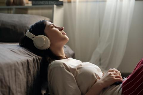 Girl listening to music with headphones