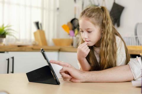 girl looking at a digital device