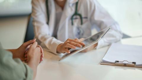 A doctor consulting with a patient.